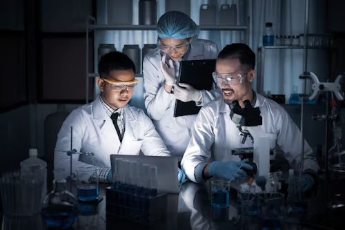 Team of experts collaborating in a lab